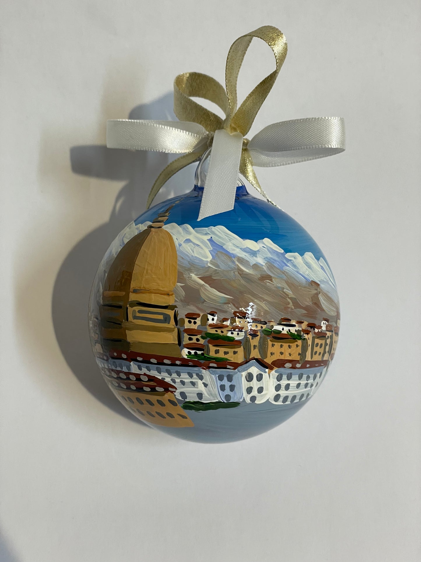 Angled view of hand-painted glass ornament – Turin Mole Antonelliana with snowy Alps and city skyline, Piedmont