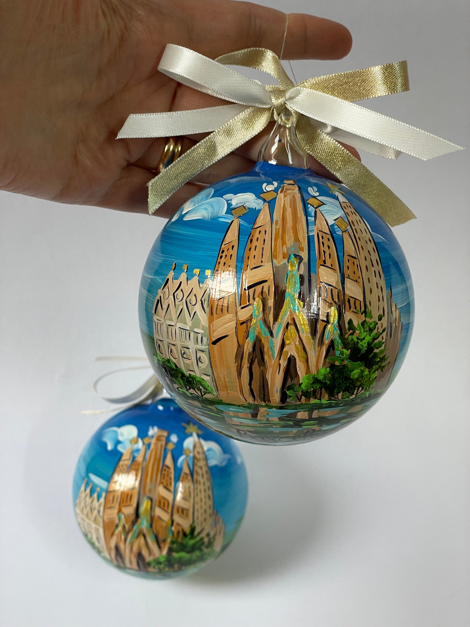 Hand-painted glass ornament – Sagrada Família golden towers with turquoise sculptures and Nativity facade, blue sky